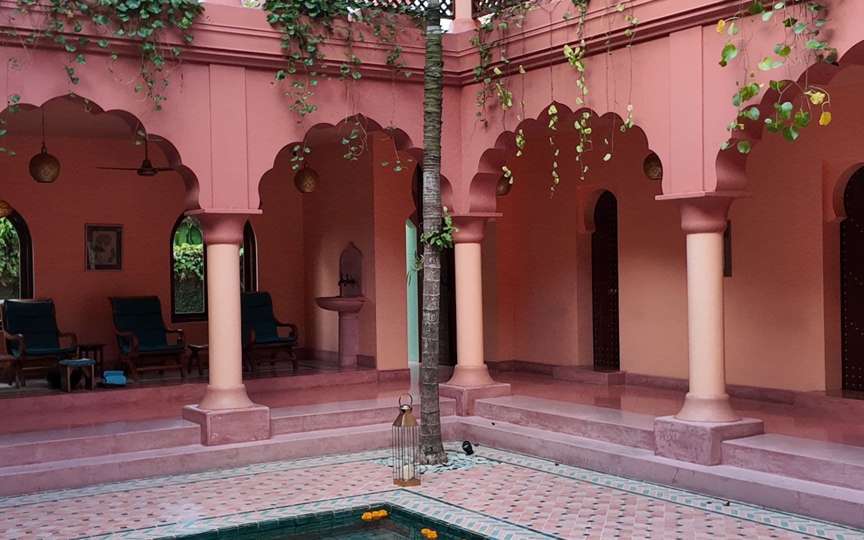 An old Goan house behind palms
